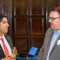 Speaker and alumni discuss before start of event